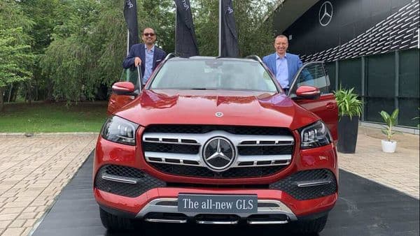 Mercedes India MD Martin Schwenk (right) posing with the newly launched 2020 GLS SUV in India,
