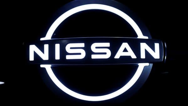 FILE PHOTO: The brand logo of Nissan Motor Corp. is seen at the front nose section of the company's new Ariya all-battery SUV during a press preview, ahead of the world premiere, at Nissan Pavilion in Yokohama, south of Tokyo, Japan July 14, 2020.  REUTERS/Issei Kato/File Photo