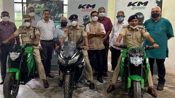Goa Police personnel pose with the KM3000 and KM4000 electric bikes from Kabira Mobility.