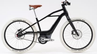 The S1 Mosh/Tribute e-bike gets glossy black paint and honey-colored leather accents.