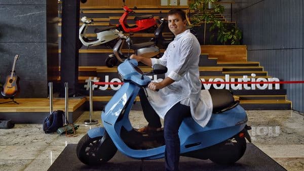 Bhavish Aggarwal, Co-founder and CEO of Ola, poses for a photograph with the new Ola electric scooter during its launch at the Ola headquarters in Bangalore on August 15, 2021.