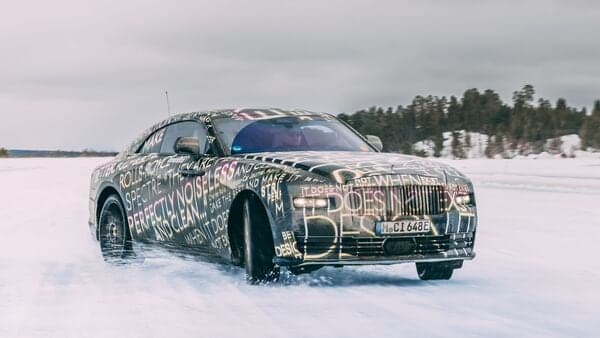 Rolls-Royce Spectre EV in action on snow near the Arctic Circle.