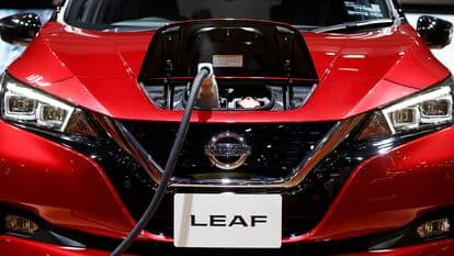 FILE PHOTO: A charging cable is attached to a Nissan Leaf electric car