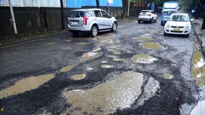 Motorists navigate huge potholes on the road near Grand Hyatt Hotel in Santacruz, Mumbai. The Ministry of Road Transport and Highways (MoRTH) shared a report recently which says that road accidents caused by potholes led to death of 5,626 people between 2018 and 2020.