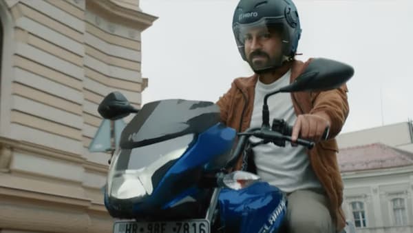 Actor Ram Charan seen in a commercial featuring Hero MotoCorp's Glamour XTEC motorcycle.