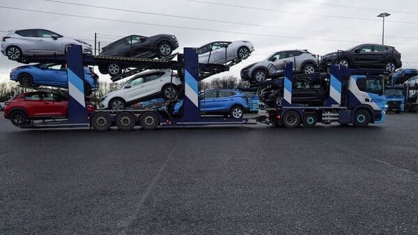 File photo of newly manufactured cars leaving on a transporter from the Nissan Motor plant in Sunderland, UK.
