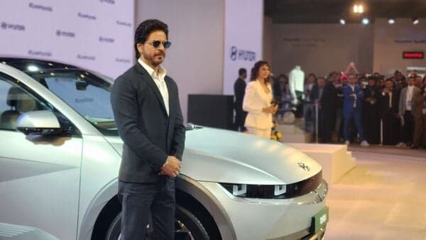 Shah Rukh Khan next to the Ioniq 5 EV at the Hyundai pavilion at the Auto Expo 2023.