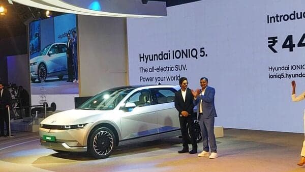 Actor Shah Rukh Khan and COO Tarun Garg with the newly launched Hyundai Ioniq 5