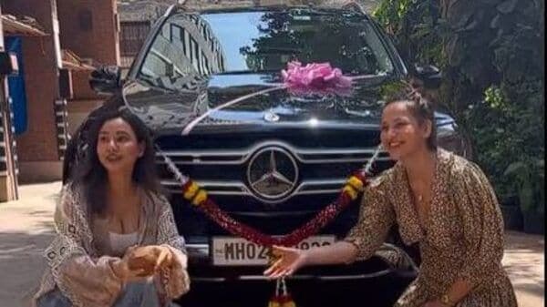 Neha Sharma and her sister Aisha Sharma along with new Mercedes-Benz GLE.