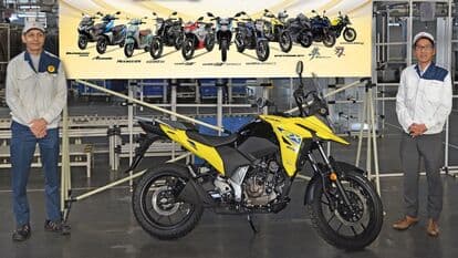 The celebratory unit is a Suzuki V-Storm SX motorcycle in Champion Yellow No. 2 colour scheme. 