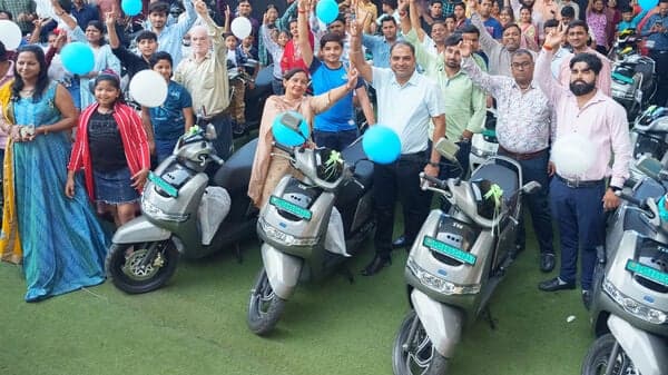 TVS iQube electric scooters being delivered in Delhi.