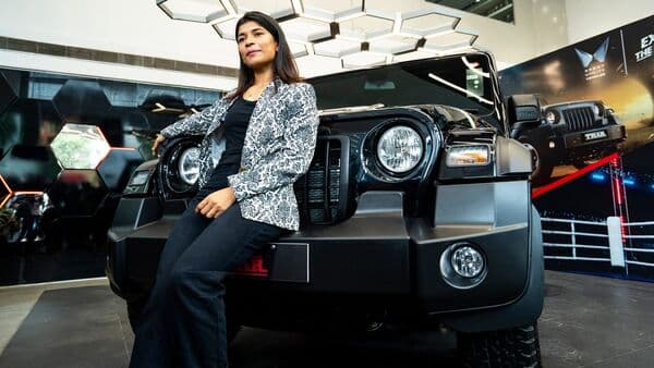 Indian boxer Nikhat Zareen poses in front of the Thar SUV she was felicitated with by Mahindra and Mahindra in South Africa.