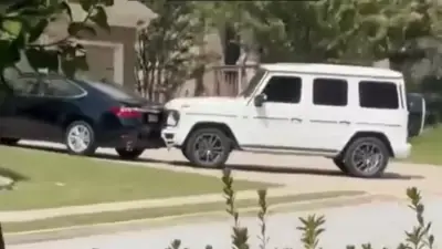 A white Mercedes-Benz G-Wagon went from driveway to driveway crashing into cars in the neighborhood of a US city. (Image: X/Everything Georgia)