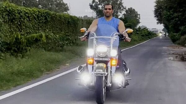 Former WWE wrestler The Great Khali shared a video of him riding a Harley Davidson Heritage Softail Classic motorcycle recently. (Image courtesy: Instagram/@thegreatkhali)