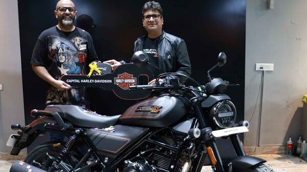 Niranjan Gupta, CEO, Hero MotoCorp, delivers the Harley-Davidson X440 to a customer in Gurugram