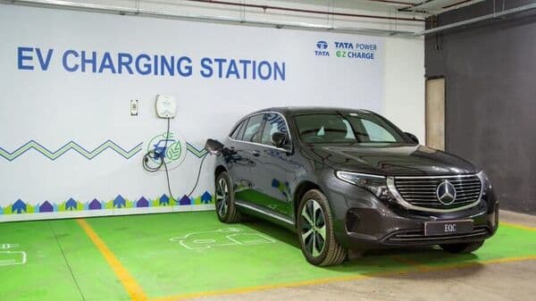 A Mercedes EQC electric SUV charges at a Tata Power EZ EV charging station.
