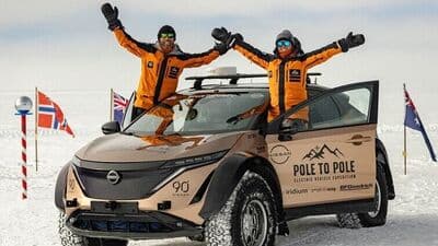 Chris and Julie Ramsey in their modified Nissan Ariya EV at the South Pole.