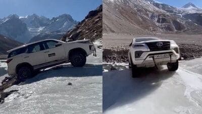 Screenshot of the video that went viral showing.a Toyota Fortuner precariously hanging from a cliff on the road between Kaza and Manali recently. The SUV, despite being an off-road capable model, skidded off the track due to dense black ice.