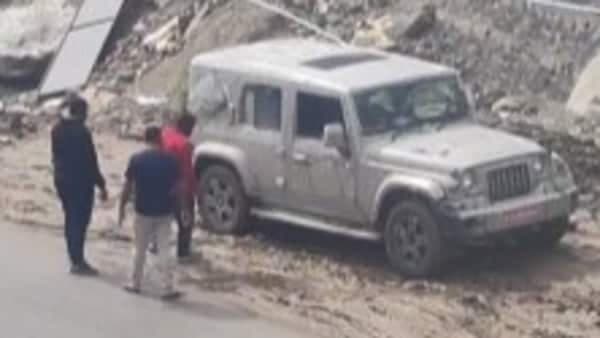 A video posted by @rajeshhimalayan shows a camouflaged Thar five-door struggling to navigate a muddy sideroad.