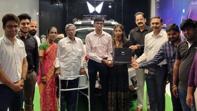 Indian chess prodigy Praggnanandhaa Rameshbabu seen with his family while receiving the Mahindra XUV400 electric SUV as a gift for reaching the finals of the chess world cup last year.