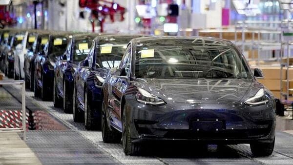 File photo: Tesla China-made Model 3 vehicles are seen during a delivery event at factory in Shanghai.