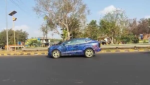 Mahindra is testing the XUV.e9 with a special new blue camouflage. 