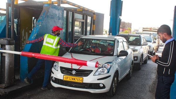 Vehicles passing through a toll plaza using FASTag toll collection system in Gurugram. Union Minister Nitin Gadkari said that the old toll collection system will soon be replaced by GPS-based toll collection.