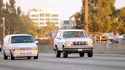 File photo of Al Cowlings, with O.J. Simpson hiding, drives a white Ford Bronco as they lead police on a two-county chase along the northbound 405 Freeway towards Simpson's home on June 17, 1994,