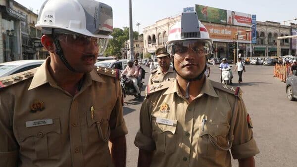 Lucknow Traffic Police personnel wearing AC helmets during a trial run conducted at Hazratganj in Lucknow on April 22. (Deepak Gupta/HT Photo)