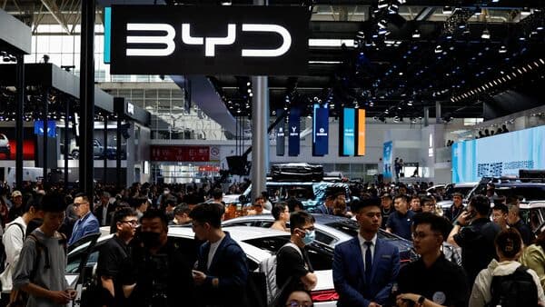 People visit the BYD booth at the Beijing International Automotive Exhibition, or Auto China 2024, in Beijing, China, 