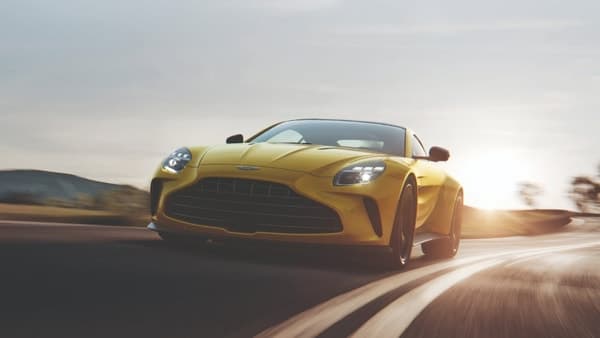 Aston Martin's revenue sank 10 per cent to £267.7 million, but the group predicted an improved performance in the second half of this year on rollout of new models.