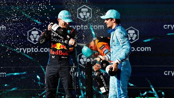 Race winner Lando Norris of Great Britain and McLaren, Second placed Max Verstappen of the Netherlands and Oracle Red Bull Racing and Third placed Charles Leclerc of Monaco and Ferrari celebrate on the podium after the F1 Grand Prix of Miami at Miami International Autodrome on May 05, 2024, in Miami, Florida